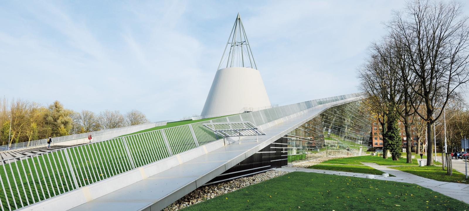 Pitched green roof with lawn and railing